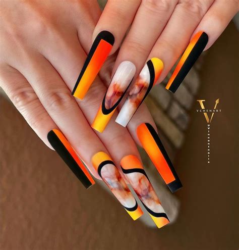 orange and black acrylic nails|bold black and orange ombre nails.